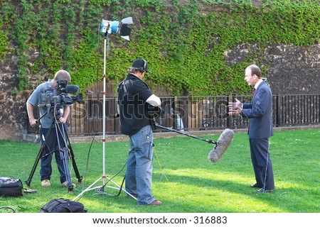 TV crew filming outside the British Parliament, I believe the presenter is the BBC\'s Andrew Marr