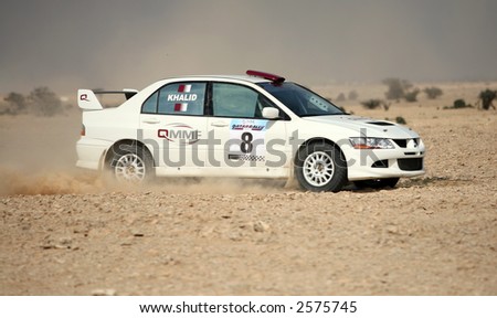 The Mitsubishi Lancer Evolution VIII driven by Khalid al-Suwaidi, co-driven Abdullah al-Rabban, at  Round 1 of the Qatar Rally 2007, on Jan 27.