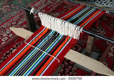 A traditional, simple, Arab loom set up to produce the sort of cloth that is common throughout the Arab world.