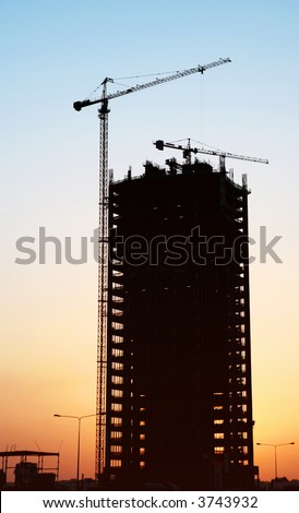 A building under construction at sunset in West Bay, Doha, Qatar, during the huge building boom of 2007.