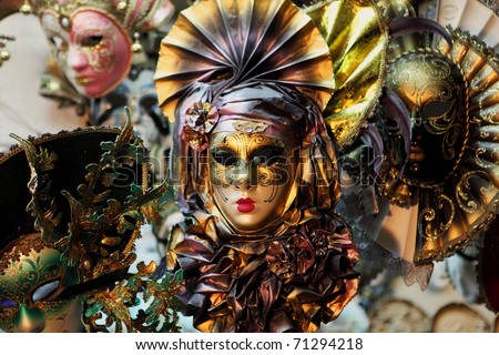 Carnevale masks on sale at a market in Venice, Italy. The masks are popular tourist souvenirs.