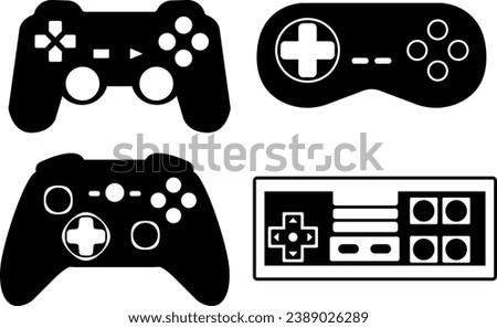 A set of isolated gamepads. A selection of various gaming joysticks, black and vector. Beautiful stylish gamepads.