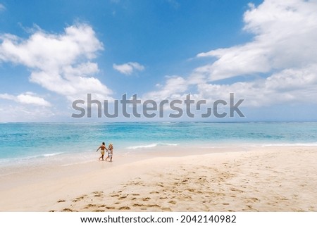 Similar – Image, Stock Photo Traveling woman walking along seashore
