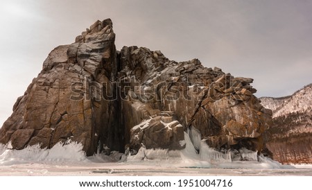 Similar – Image, Stock Photo Picturesque landscape of rocks in sea on sunset