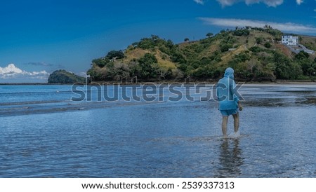 Similar – Image, Stock Photo Sandy seashore near hill with houses under cloudy sky