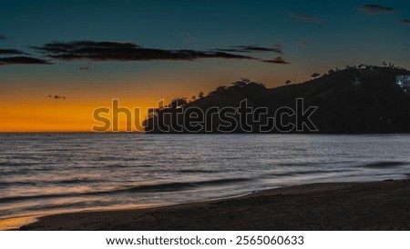Image, Stock Photo Sandy seashore near hill with houses under cloudy sky