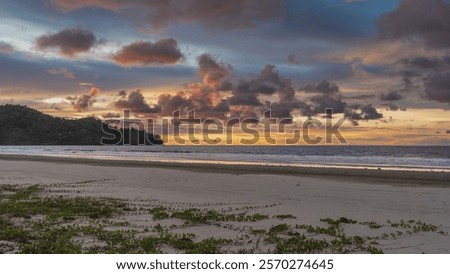 Similar – Image, Stock Photo Sandy seashore near hill with houses under cloudy sky