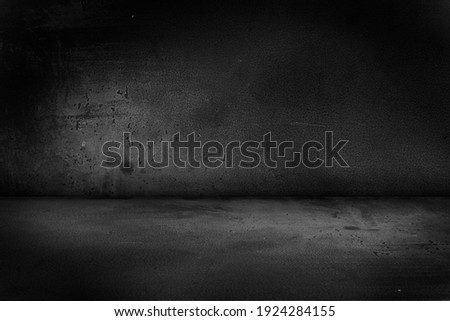 Black, dark and gray abstract cement wall and studio room , interior texture for display products. Room black floor is made of dark plaster for interior decoration or gym for exercise.