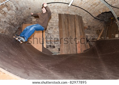 Man skating a half pipe