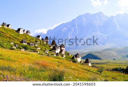 Mountain village on a mountain slope. Village in mountains. Mountain village ruins. Mountain village cabins