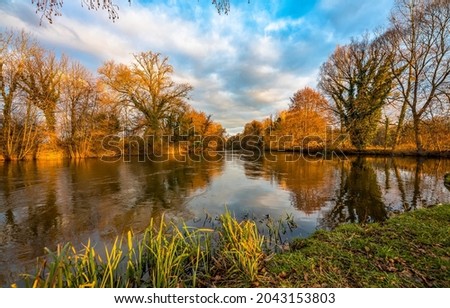Picturesque river in the autumn season. River in autumn scene. Autumn river view
