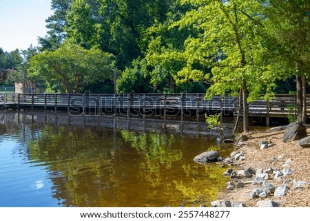 Similar – Image, Stock Photo Rippling lake surrounded by rocky mountains against cloudy blue sky