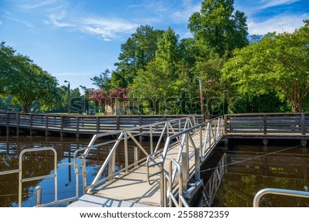 Similar – Image, Stock Photo Rippling lake surrounded by rocky mountains against cloudy blue sky