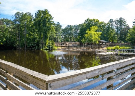 Similar – Image, Stock Photo Rippling lake surrounded by rocky mountains against cloudy blue sky