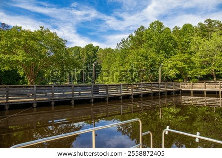 Similar – Image, Stock Photo Rippling lake surrounded by rocky mountains against cloudy blue sky