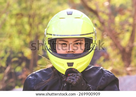 women wearing yellow full face motorcycle helmet, biker girl.