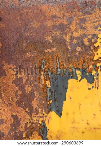old rusty metal surface painted with yellow paint, texture, background