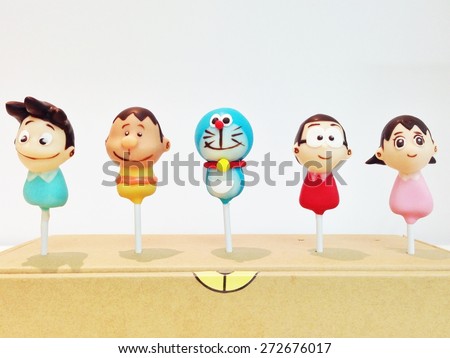 BANGKOK - NOV 28, 2014 : Photo of Doraemon and friends cake pops, by Pop me Up. Characters from left to right : Suneo, Gian, Doraemon, Nobita, Shizuka. Doraemon is a famous Japanese animation series.
