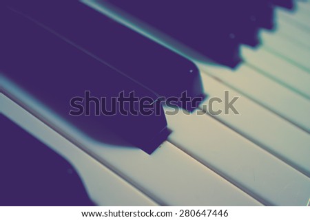 Closed-up of Piano Keys. Close Frontal View. In Cold Vintage Style. Selective Focus
