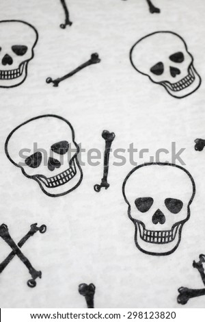 Closed up of Cloth Fabric with Skulls and Bones, Made from Cotton, Texture, Background, Wallpaper, Halloween Concept