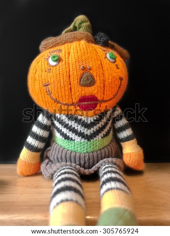Closed up of Pumpkin Plush Doll with Chalk Black Board, Halloween Concept