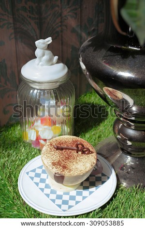 Tiramisu Cake in a White Chocolate Cup and Chocolate Key on Top, Alice in Wonderland Theme