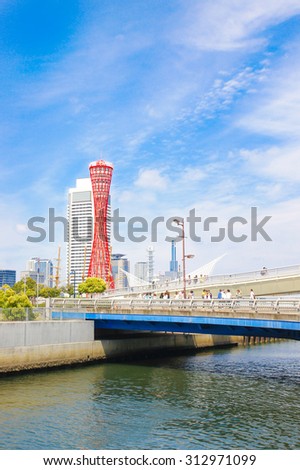 KOBE, JAPAN - JUNE 1, 2015 : : Kobe Port Tower and Maritime Museum stand as symbols of prosperity in Meriken Park in Kobe, Japan.