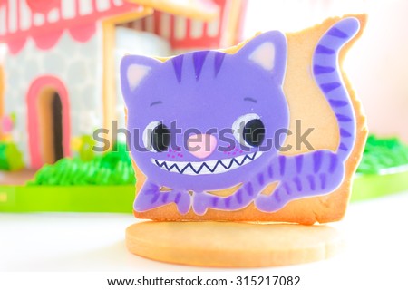 Bangkok - SEPT 5, 2015 : A Sugar Cookie Cheshire Cat & House [all edible], Alice in Wonderland theme. A Novel, by an English author Lewis Carroll, was reproduced as movies & animations. soft focus