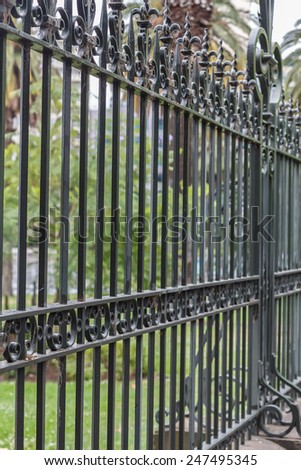 Metal fence with green background. Melbourne, Australia