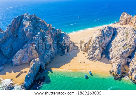 Aerial view of Lovers Beach at Lands End, Cabo San Lucas, Mexico. The side facing the Sea of Cortez is named Lovers Beach while the side facing the Pacific Ocean is named Divorce Beach