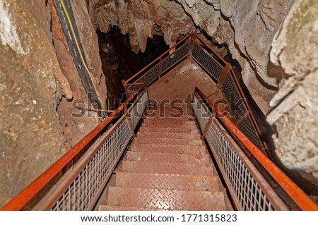 Little known cave Dobrostanski biser - Bulgaria. Ladder with iron steps leading underground Imagine de stoc © 