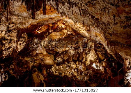 Little known cave Dobrostanski biser - Bulgaria. Illuminated and ennobled cave in which are extremely rare cave pearls Imagine de stoc © 