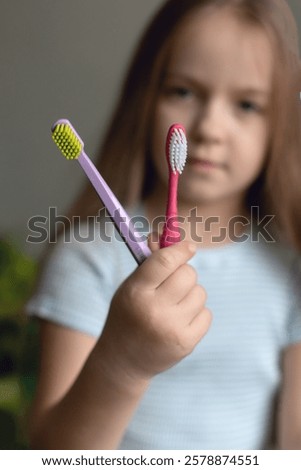 Similar – Image, Stock Photo Small Caucasian Girl Holding Sign and Pencil in Home Kitchen