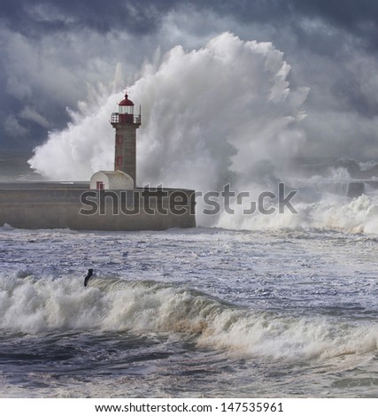 Storm waves over the Lighthouse, Portugal - enhanced blue sky