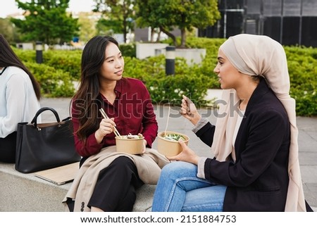 Similar – Image, Stock Photo Ethnic businesswoman eating sushi and working on laptop in cafe