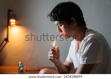 Similar – Image, Stock Photo Young man smoking cigarette in the night