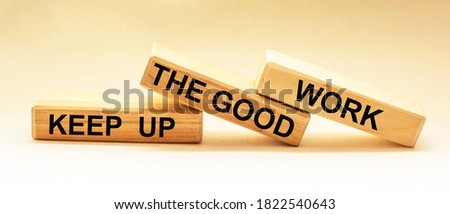 Keep up the good work, text is written on wooden blocks Foto d'archivio © 