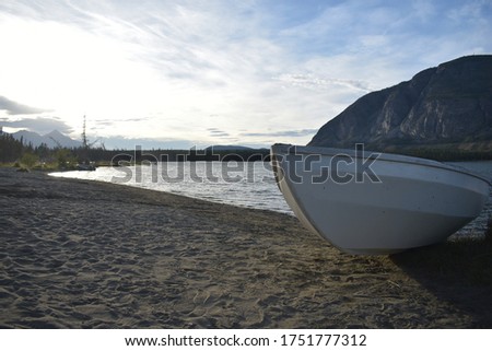 Similar – Image, Stock Photo On the shore of a lake the angler waits for his catch