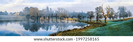 Panorama of the morning mist over the pond. Misty morning fog ove pond. Misty morning pond panorama. Pond panorama in morning