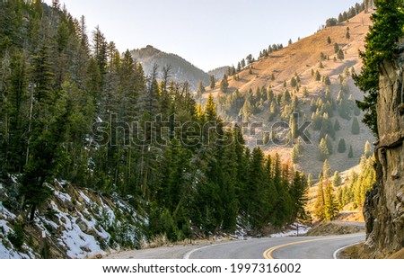 Mountain road among the rocks. Mountain road turn. Winding mountain road. Mountain road landscape