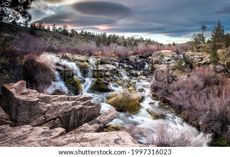 Fast stream in the valley. River stream view. River stream landscape. River stream in valley