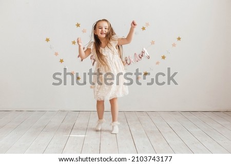 Similar – Image, Stock Photo Playful little girl jumping over sea waves on a sand beach at sunset