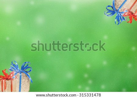 Christ mas day. The abstract green blurry with gift and snow fall