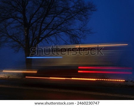 Similar – Image, Stock Photo A motion blurred close up shot of the fingers of a young adult Working from Home on a laptop kept on a wooden desk next to a pen and a notepad.