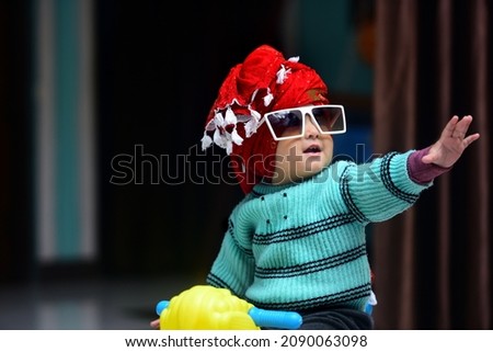 Image, Stock Photo 13 month old baby trying to navigate a ladder at a playground; reaching and pulling up to tip toes