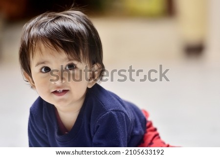 Similar – Image, Stock Photo 13 month old baby trying to navigate a ladder at a playground; reaching and pulling up to tip toes