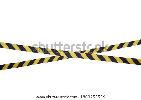 Black and yellow lines of barrier tape prohibit passage. Barrier tape on white isolate. Barrier that prohibits traffic. Warning tape. Danger unsafe area warning do not enter. Concept of no entry