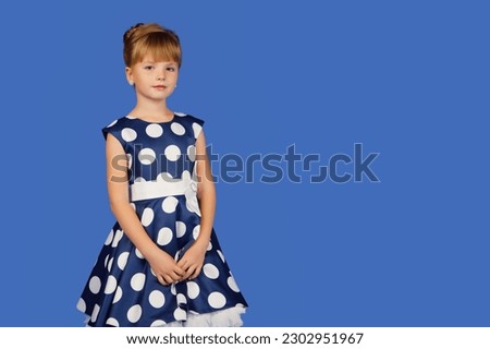 Similar – Image, Stock Photo Little girl, eight years old, sitting on the grass outdoors.