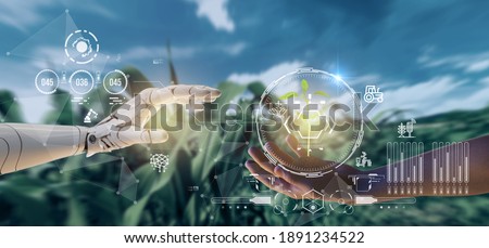 smart agriculture futuristic industry 4.0 technology concept, cyborg hand put to touch hand with green leaves with hud technology including artificial intelligence, 5g to analysis data of smart farm