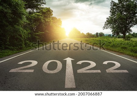 New year 2022 or straightforward concept. Text 2022 written on the road in the middle of asphalt road at sunset.Concept of planning and challenge, business strategy, opportunity ,hope, new life change Foto d'archivio © 